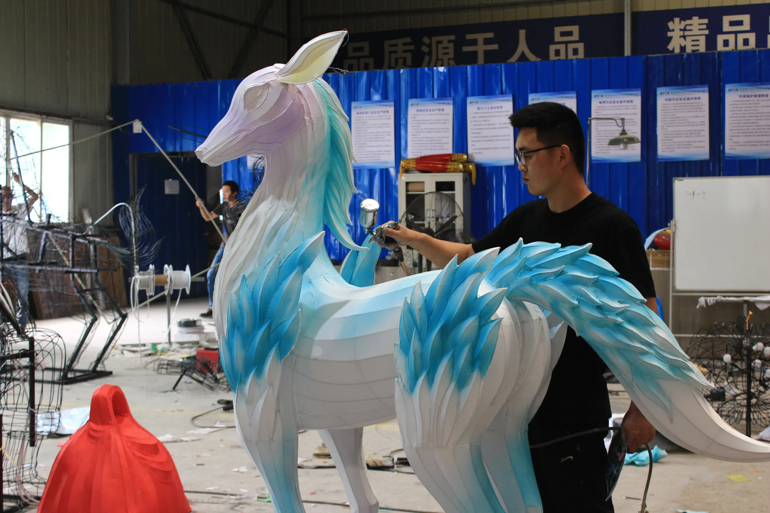 Airbrushing and painting bespoke traditional silk lantern