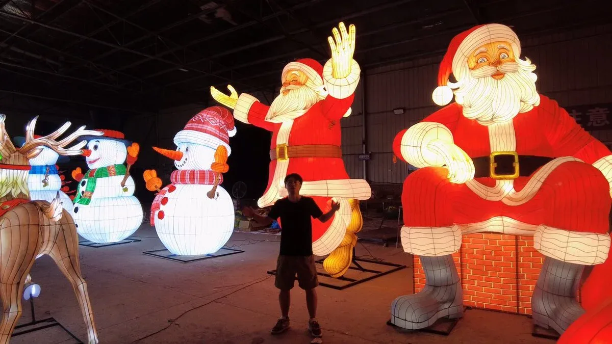 custom lantern Christmas display with Santa figures and factory staff