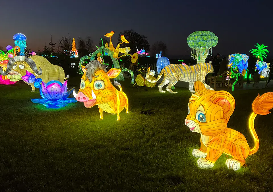 zoo animal lantern night trail with giraffe lion and bird figures